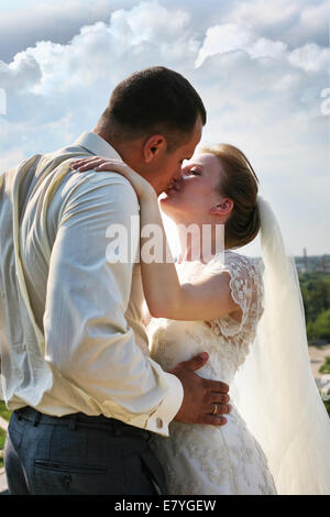 Beautiful the bride and the groom kiss Stock Photo