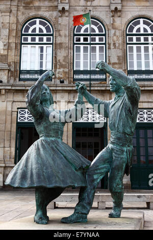 Statue of couple dancing outside railway station building, Viana do Castelo , Minho Province, northern Portugal Stock Photo