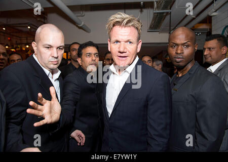 Hong Kong, China SAR Gordon Ramsey and his minders work the crowd at the Opening of Gordon Ramsey's Bread Street restaurant. Stock Photo