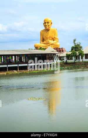 Giant statue of famous thai monk and the reflection, the statue is located in Ayutthaya Province, Thailand Stock Photo