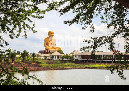 Giant statue of famous thai monk located in ayutthaya province, near the highway to northern thailand. Stock Photo