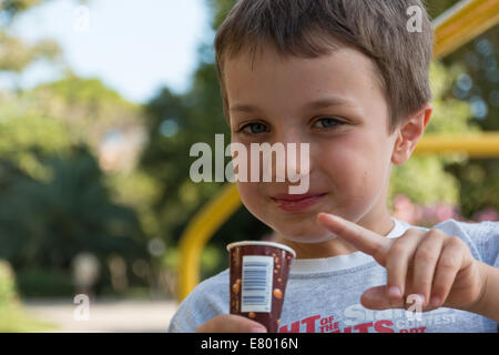 child smiling with popsicle, child with lolly, child with ice-cream Stock Photo