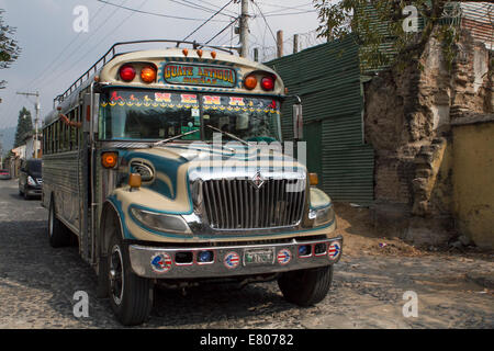 Old American bus on the road, Antigua, Travel to Guatemala Stock Photo