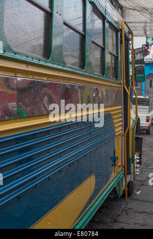 Side view o f an old American bus aka chicken bus, Travel to Guatemala Stock Photo