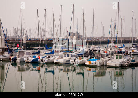 Fishing boats and motor yachts in oldest harbour of UNESCO world heritage Le Havre in Normandy, France Stock Photo