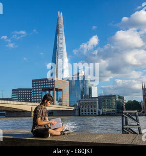 Asian Youth Studying Reading Book River Thames London Stock Photo