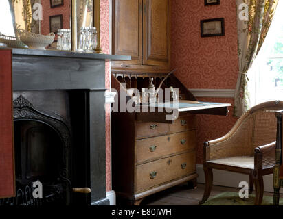 Charles Dickens birthplace museum with drawing room containing bureau and fireplace Stock Photo