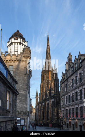 Castlehill, Edinburgh, looking towards the Camera Obscura (left) and The Hub (right). Some people are walking in the street. Stock Photo