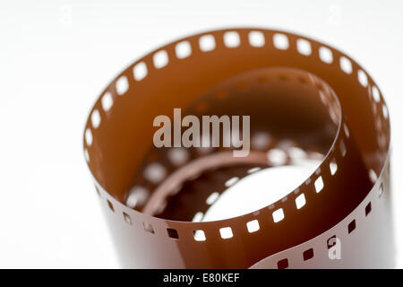 Rolled undeveloped film strip isolated white background Stock Photo - Alamy