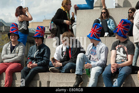Young men in Union Jack Hats. Trafalgar Square, London, England. Stock Photo