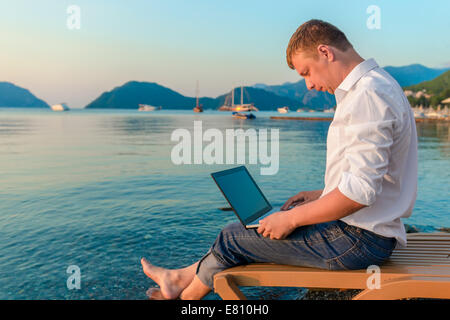 beautiful and very successful male working outdoors Stock Photo