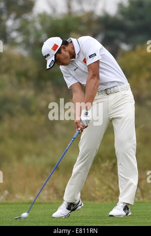 Incheon, South Korea. 28th Sep, 2014. Bai Zhengkai of China competes during the golf men's team match at the 17th Asian Games in Incheon, South Korea, Sept. 28, 2014. China ranked 4th. Credit:  Gao Jianjun/Xinhua/Alamy Live News Stock Photo