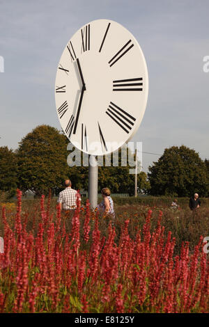 Bruton, Somerset. Sunday 28th September 2014. Beautiful autumn weather on the last weekend of September brought many visitors to the Hauser & Wirth gardens at their gallery in Bruton Somerset, UK. The gardens were designed by Dutch landscape designer Piet Oudolf and include Anri Sala’s “Clocked Perspective”. Stock Photo