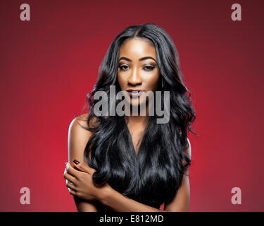 Black beautiful woman with long luxurious shiny hair Stock Photo
