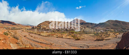 Horizontal panoramic (2 picture stitch) landscape of a traditional Berber mudbrick village in the High Atlas Mountains. Stock Photo