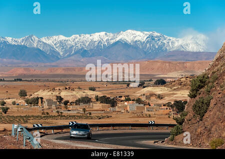 Horizontal view of a car on the N9 highway through the Mid and High Atlas Mountain range in Morocco. Stock Photo