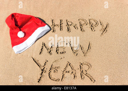 written in the sand, "happy new year" Stock Photo