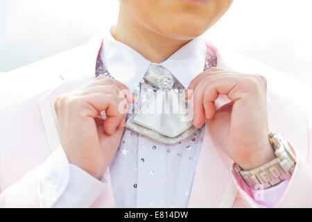 Young man adjusting his suit Stock Photo
