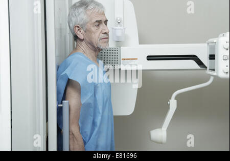 Man in 70s undergoing x-ray scan. Stock Photo