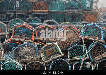 Colourful lobster and crab creels, stacked on the quayside at Scarborough, North Yorkshire, UK Stock Photo