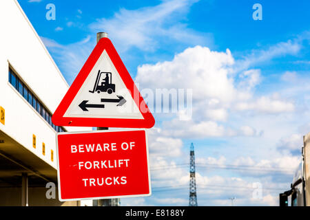 Beware of forklift sign on blue sky Stock Photo