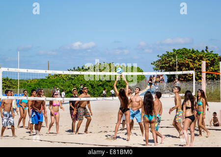 Miami Beach Florida,volleyball game,net,adult adults man men male,woman women female lady,Hispanic Latin Latino ethnic immigrant immigrants minority,p Stock Photo