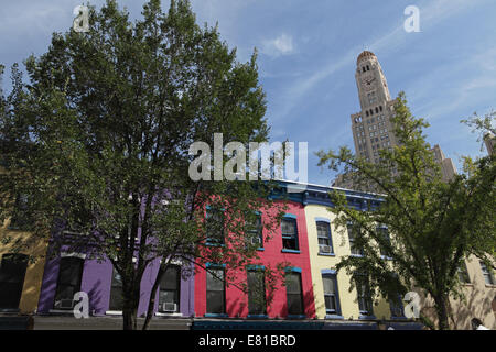 Colorful houses on Atlantic Avenue in Brooklyn Williamburg Savings Bank building in background Stock Photo