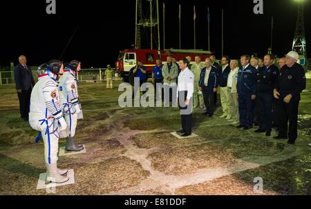 Oleg Ostapenko, General Director of the Russian Federal Space Agency greets International Space Station Expedition 41 crew members before they board for launch aboard the Soyuz TMA-14M spacecraft to the International Space Station September 25, 2014 in Baikonur, Kazakhstan. Samokutyaev, Serova and Wilmore will spend the next five and a half months living and working aboard the ISS. Stock Photo