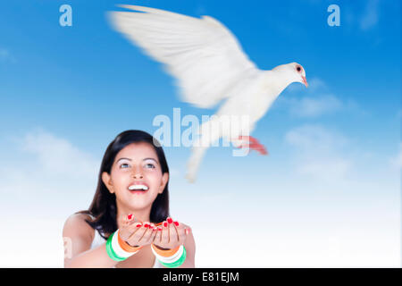 indian Girl Flying Pigeon Stock Photo