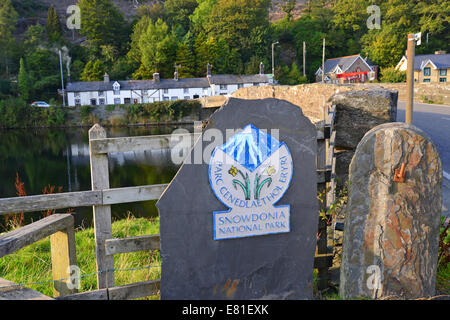 Sign at entrance to Snowdonia National Park by Machynlleth bridge, Gwynedd, Wales (Cymru), United Kingdom Stock Photo