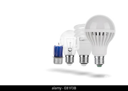 Evolution - LED Bulb, Fluorescent Bulb, Tungsten Bulb, Candle Concept Stock Photo