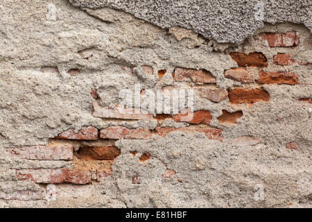 old wall texture peeling to brick red Stock Photo