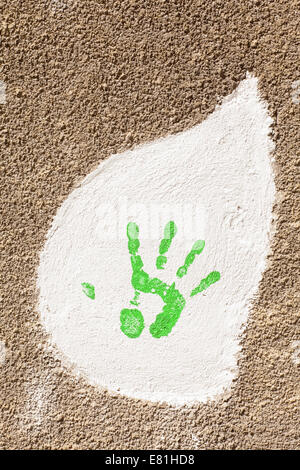 old wall with a hand imprint on repair Stock Photo
