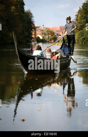 Bamberg, Germany. 27th Sep, 2014. A gondolier entertains tourists on his Venetian gondola in Bamberg, Germany, 27 September 2014. Foto: David Ebener/dpa/Alamy Live News Stock Photo