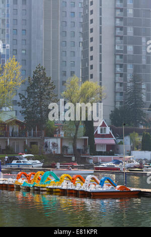 Pedal boats on the Old Danube River with Donau City, Donau City, Vienna, State of Vienna, Austria Stock Photo