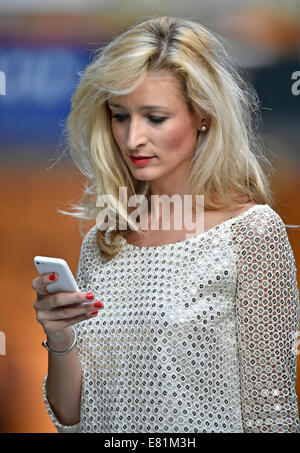 Young woman using a mobile phone, Stuttgart, Baden-Württemberg, Germany Stock Photo