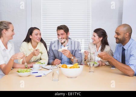 Workers laughing while enjoying lunch break Stock Photo