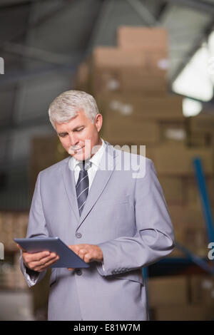 Male manager using digital tablet Stock Photo