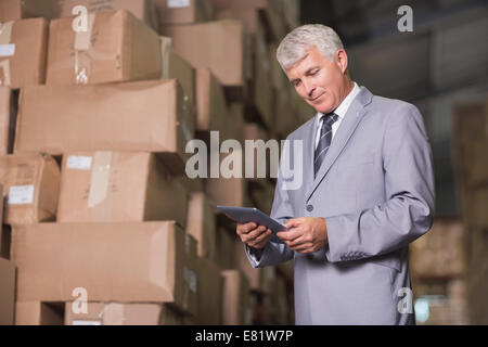 Male manager using digital tablet Stock Photo