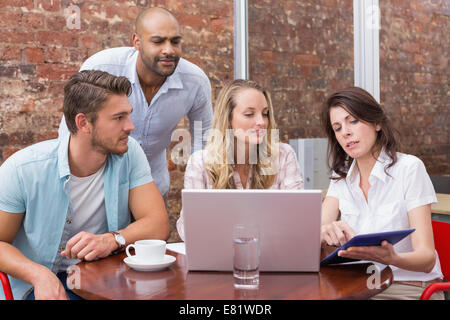 Business team talking and using tablet pc Stock Photo