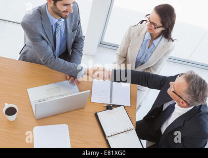 Business partners shaking hands Stock Photo