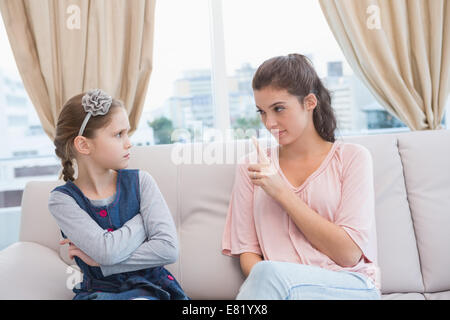 Mother scolding her naughty daughter Stock Photo