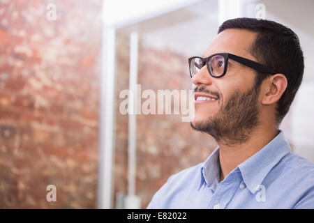 Thoughtful young businessman looking away Stock Photo