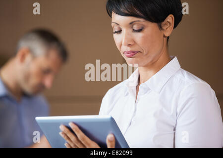Female manager using digital tablet in warehouse Stock Photo