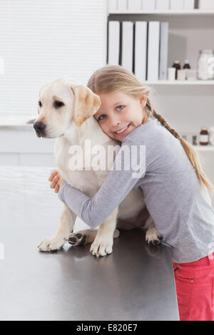 Happy owner hugging her cute dog Stock Photo