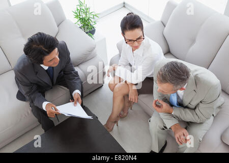 Business team discussing meeting notes Stock Photo