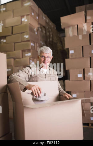 Man working in warehouse Stock Photo