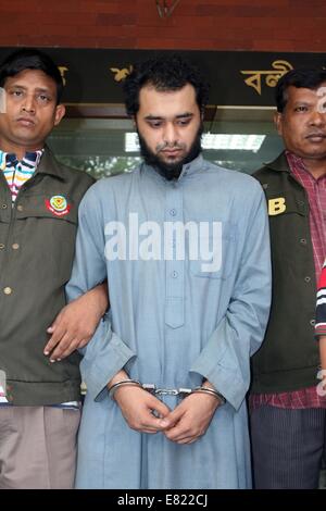 Bangladeshi police present Samiun Rahman , a British citizen of Bangladeshi origin, on suspicion of ties with global jihadist organizations in Dhaka on September 29, 2014. Bangladesh police said September 29 they arrested a British citizen suspected of entering the country to recruit militants for jihadist groups overseas such as the Islamic State organization. Stock Photo