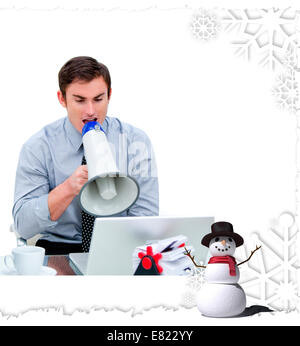 Angry businessman yelling through a megaphone Stock Photo
