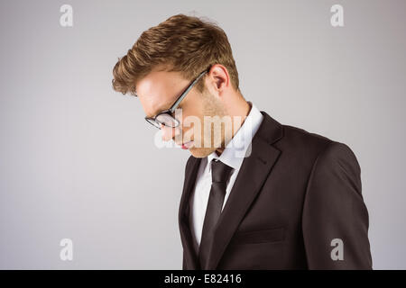 Young handsome businessman looking down Stock Photo